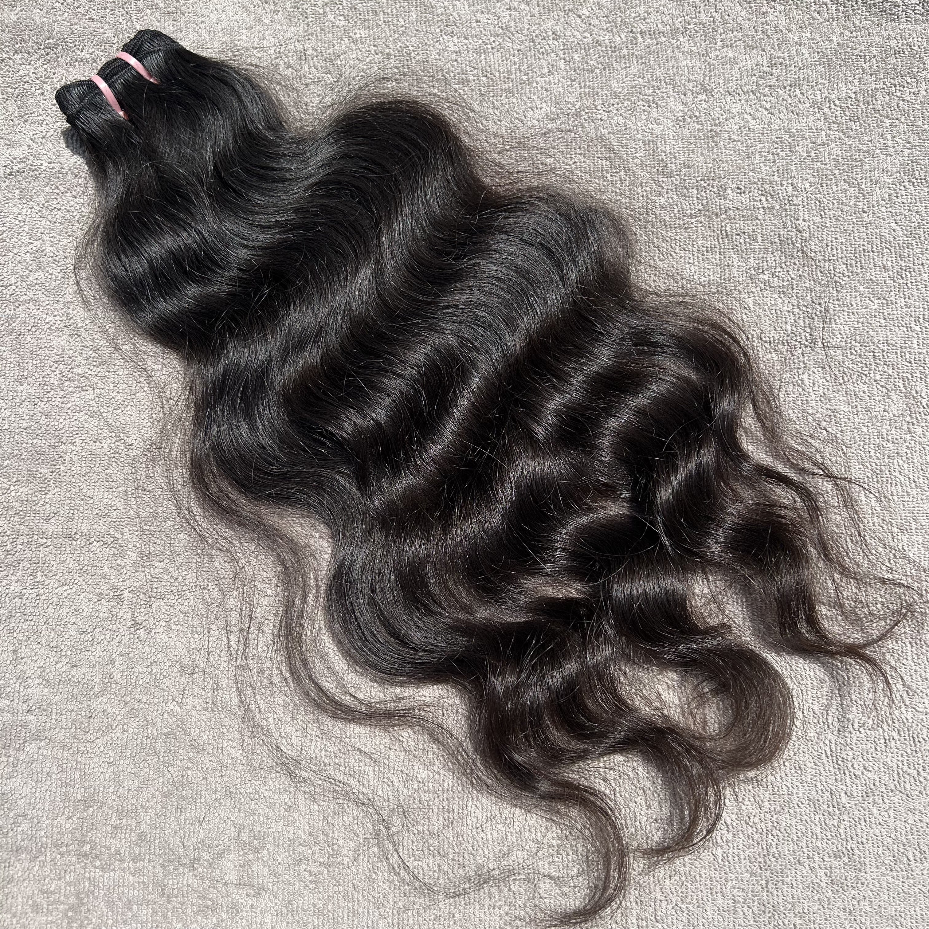Curly hair bundle on a textured gray background